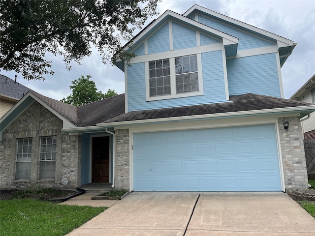13523 La Concha Ln, Houston, TX 77083 - traditional home with driveway, an attached garage, and roof with shingles