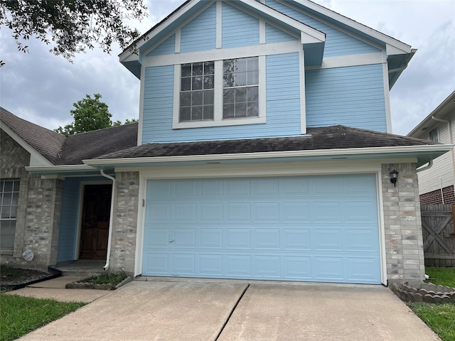 13523 La Concha Ln, Houston, TX 77083 - traditional home with driveway, an attached garage, and a shingled roof
