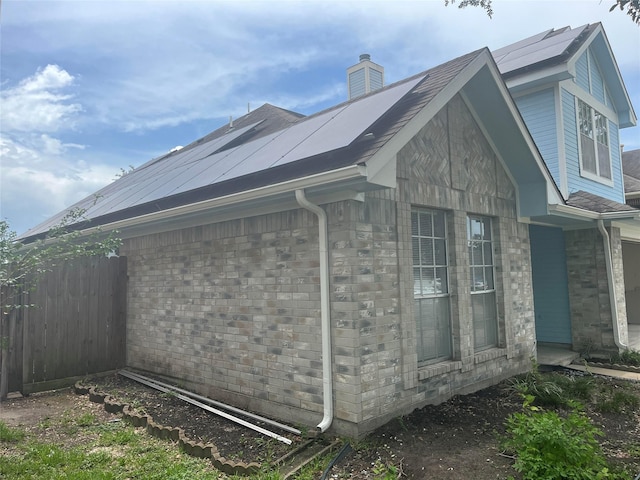 13523 La Concha Ln, Houston, TX 77083 - view of property exterior with a chimney