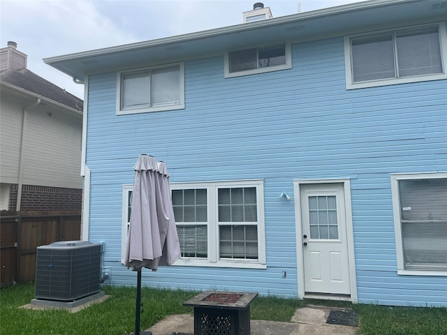 13523 La Concha Ln, Houston, TX 77083 - back of property featuring central AC and a chimney