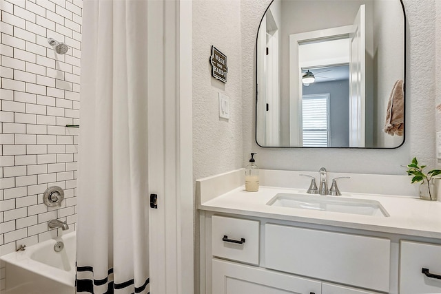 24910 Hibiscus Garden Way, Katy, TX 77493 - bathroom featuring a textured wall, vanity, and shower / bath combination with curtain