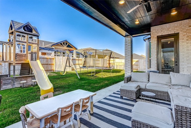 24910 Hibiscus Garden Way, Katy, TX 77493 - view of patio / terrace with a playground, an outdoor hangout area, a trampoline, outdoor dining space, and a ceiling fan