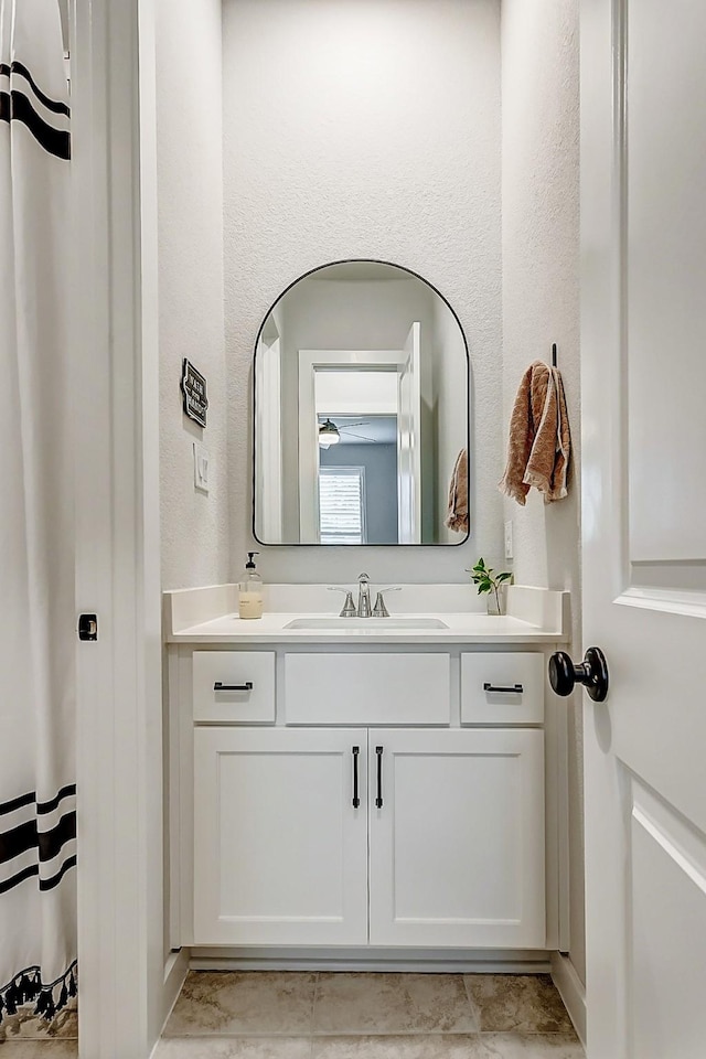 24910 Hibiscus Garden Way, Katy, TX 77493 - bathroom featuring vanity and a textured wall
