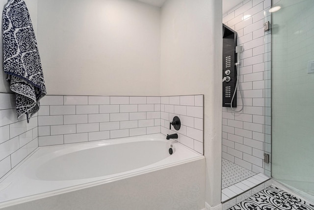 16731 Foursquare Dr, Conroe, TX 77385 - full bath featuring a stall shower, a bath, and tile patterned floors