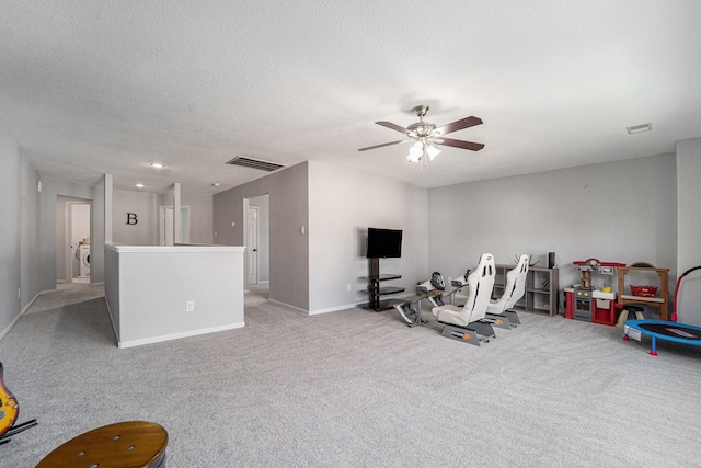 16731 Foursquare Dr, Conroe, TX 77385 - rec room featuring carpet, a ceiling fan, baseboards, and a textured ceiling