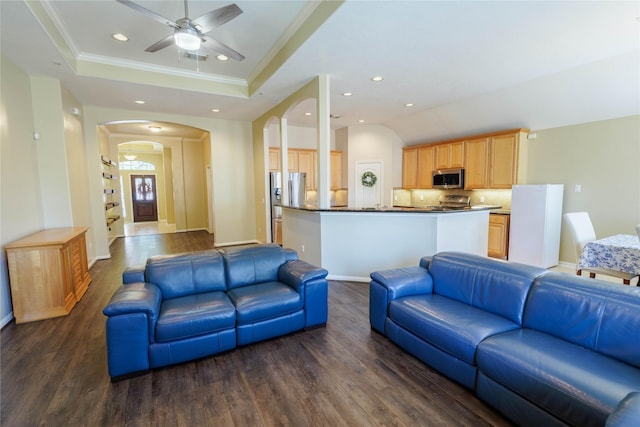 5910 Hatfield Glen Dr, Katy, TX 77449 - living area with recessed lighting, dark wood-style floors, a ceiling fan, arched walkways, and ornamental molding