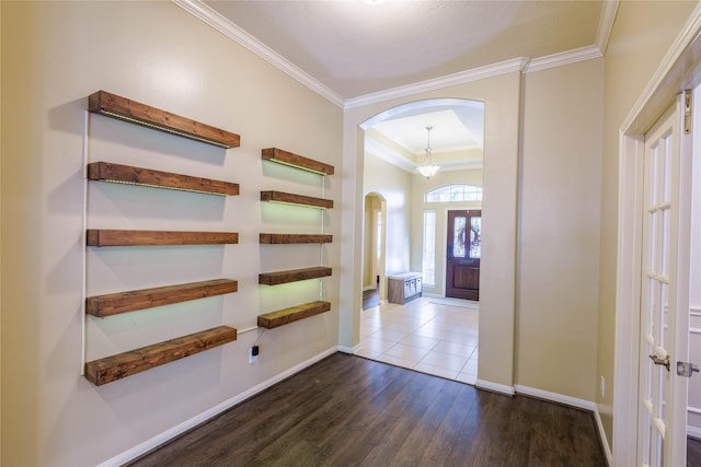 5910 Hatfield Glen Dr, Katy, TX 77449 - foyer featuring arched walkways, dark wood-type flooring, and ornamental molding