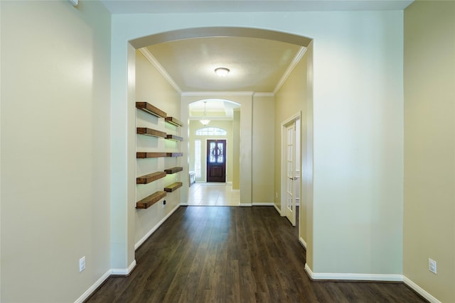 5910 Hatfield Glen Dr, Katy, TX 77449 - hall with arched walkways, crown molding, and dark wood-style flooring