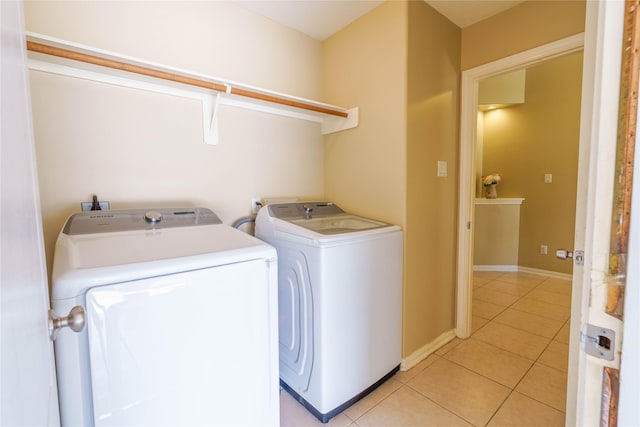 5910 Hatfield Glen Dr, Katy, TX 77449 - laundry area featuring washer and dryer and light tile patterned flooring