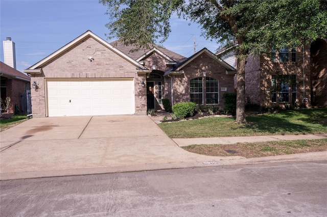5910 Hatfield Glen Dr, Katy, TX 77449 - view of front of property featuring concrete driveway, brick siding, a front lawn, and an attached garage