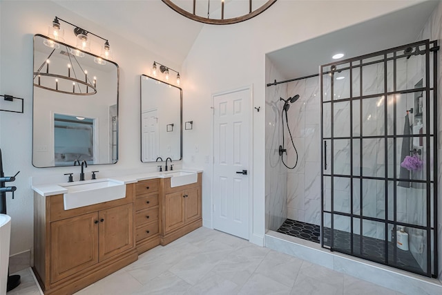 8113 Tranquil Lake Way, Conroe, TX 77385 - full bathroom featuring tiled shower, double vanity, lofted ceiling, a chandelier, and marble finish flooring