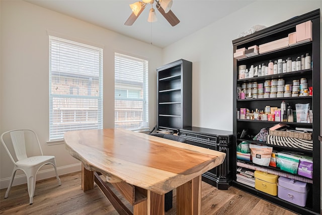 8113 Tranquil Lake Way, Conroe, TX 77385 - office area featuring ceiling fan, light wood-style floors, and baseboards