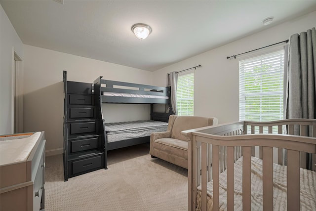 8113 Tranquil Lake Way, Conroe, TX 77385 - bedroom featuring light colored carpet and baseboards