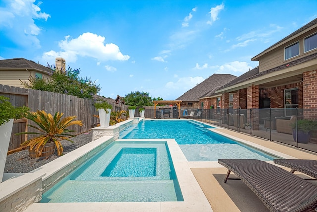 8113 Tranquil Lake Way, Conroe, TX 77385 - view of pool featuring an in-ground hot tub, a fenced backyard, and a patio area