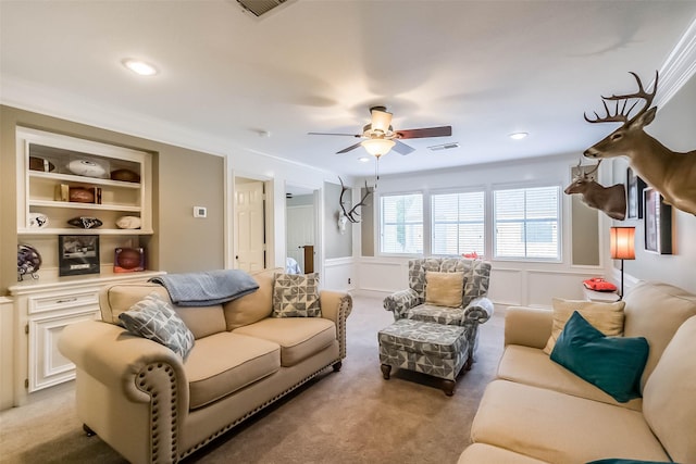 20727 Sea Pine Dr, Katy, TX 77450 - living room featuring ceiling fan, a decorative wall, light carpet, a wainscoted wall, and recessed lighting