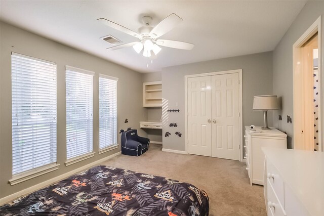 20727 Sea Pine Dr, Katy, TX 77450 - bedroom with light colored carpet, a closet, ceiling fan, and baseboards