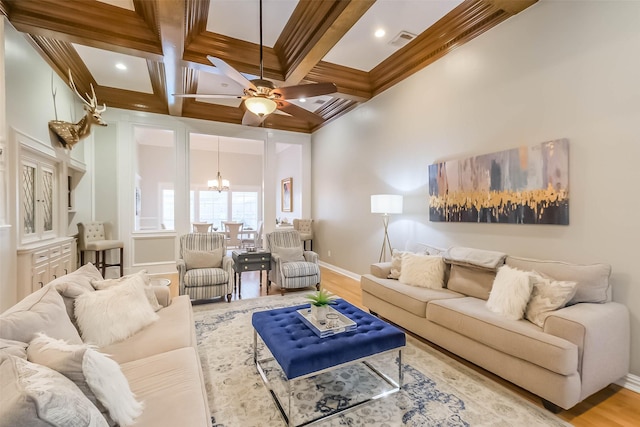 20727 Sea Pine Dr, Katy, TX 77450 - living area with baseboards, a chandelier, coffered ceiling, crown molding, and wood finished floors