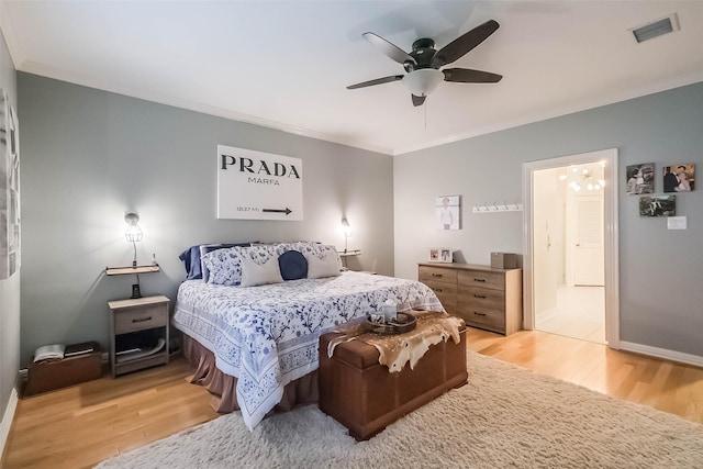 20727 Sea Pine Dr, Katy, TX 77450 - bedroom with ornamental molding, light wood-style flooring, baseboards, ceiling fan, and ensuite bathroom