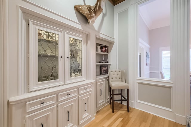20727 Sea Pine Dr, Katy, TX 77450 - detailed view of wood finished floors, built in features, and crown molding