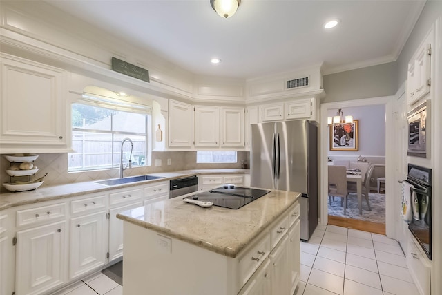 20727 Sea Pine Dr, Katy, TX 77450 - kitchen featuring black appliances, a sink, white cabinetry, light stone countertops, and light tile patterned flooring