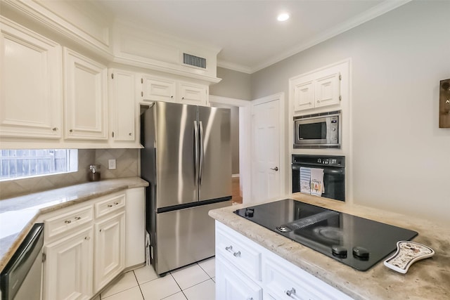 20727 Sea Pine Dr, Katy, TX 77450 - kitchen featuring black appliances, backsplash, crown molding, light stone counters, and light tile patterned floors
