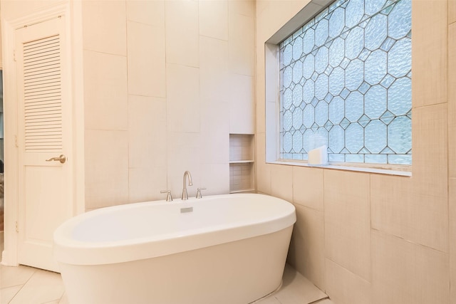 20727 Sea Pine Dr, Katy, TX 77450 - full bathroom with tile walls, a freestanding bath, and tile patterned floors