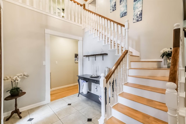 20727 Sea Pine Dr, Katy, TX 77450 - staircase with tile patterned flooring and baseboards