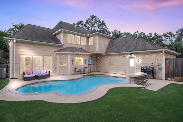 20727 Sea Pine Dr, Katy, TX 77450 - pool at dusk featuring an outdoor living space, a patio area, and a grill