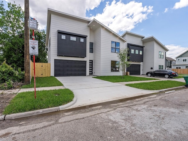 2207 Dan St, Houston, TX 77020 - contemporary house with a garage and concrete driveway
