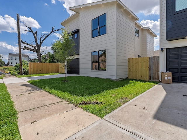2207 Dan St, Houston, TX 77020 - view of side of home with concrete driveway and a garage