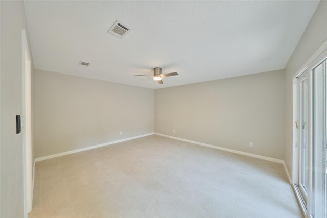 60 Hickory Oak Dr, The Woodlands, TX 77381 - empty room with a ceiling fan, baseboards, and plenty of natural light