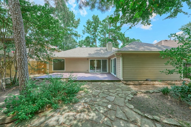 60 Hickory Oak Dr, The Woodlands, TX 77381 - back of property featuring a chimney, a patio, and roof with shingles