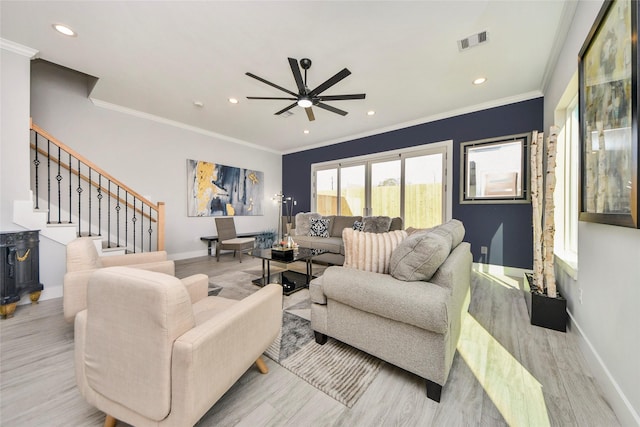 3033 Dennis St, Houston, TX 77004 - living area with wood finished floors, baseboards, a ceiling fan, recessed lighting, and stairs