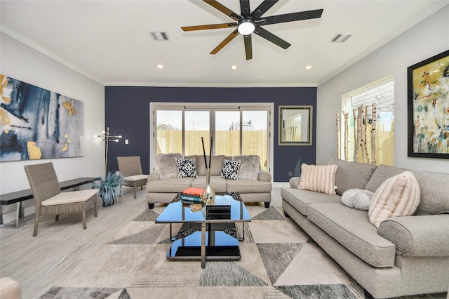 3033 Dennis St, Houston, TX 77004 - living room with healthy amount of natural light, wood finished floors, ornamental molding, ceiling fan, and recessed lighting