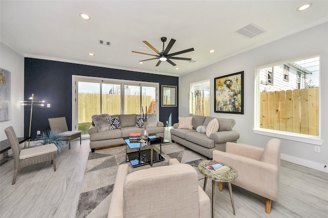 3033 Dennis St, Houston, TX 77004 - living room featuring light wood-type flooring, crown molding, ceiling fan, recessed lighting, and baseboards