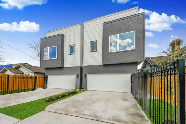 3033 Dennis St, Houston, TX 77004 - view of front of property featuring an attached garage, stucco siding, fence, and driveway