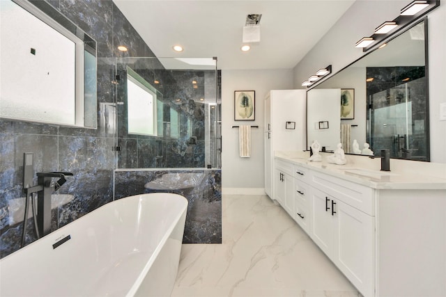 3033 Dennis St, Houston, TX 77004 - full bathroom featuring marble tiled flooring, a shower stall, a freestanding bath, double vanity, and recessed lighting
