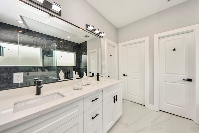 3033 Dennis St, Houston, TX 77004 - bathroom featuring a marble finish shower, marble look tile flooring, and double vanity