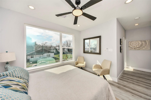 3033 Dennis St, Houston, TX 77004 - bedroom with baseboards, wood finished floors, recessed lighting, and ceiling fan