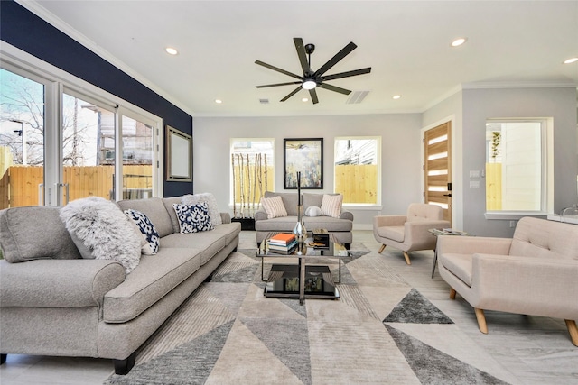 3033 Dennis St, Houston, TX 77004 - living area featuring recessed lighting, ceiling fan, plenty of natural light, ornamental molding, and baseboards
