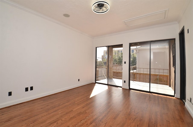 1425 Nantucket Dr Unit D, Houston, TX 77057 - spare room with wood finished floors, crown molding, baseboards, and attic access