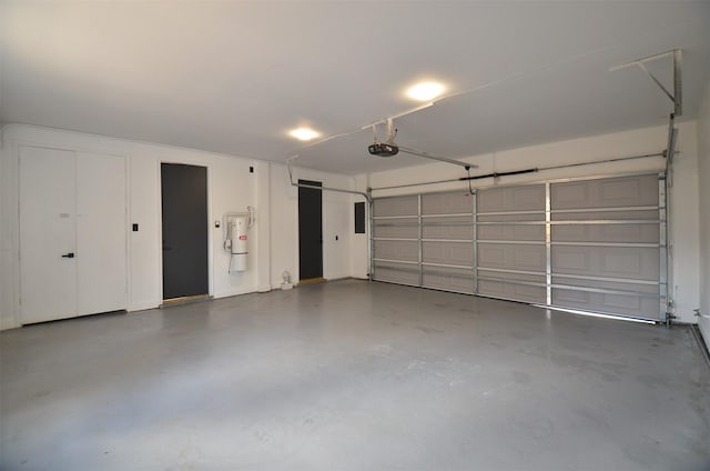 1425 Nantucket Dr Unit D, Houston, TX 77057 - garage with a garage door opener and a central vacuum unit
