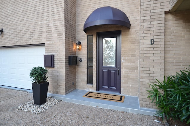 1425 Nantucket Dr Unit D, Houston, TX 77057 - property entrance with brick siding and a garage