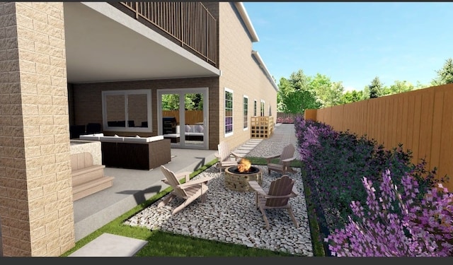 1425 Nantucket Dr Unit D, Houston, TX 77057 - view of patio featuring an outdoor living space with a fire pit