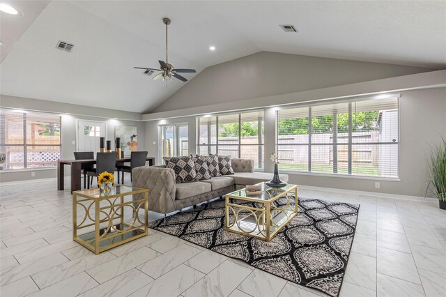2720 Hot Springs Dr, Pearland, TX 77584 - living room with vaulted ceiling, healthy amount of natural light, light marble finish flooring, ceiling fan, and baseboards
