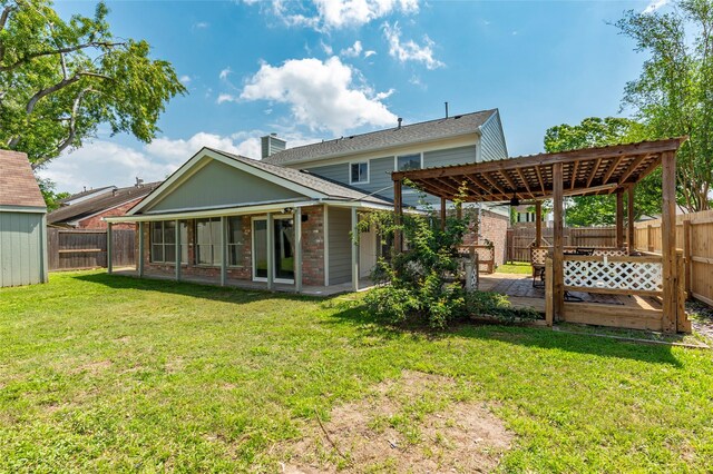 2720 Hot Springs Dr, Pearland, TX 77584 - rear view of house with a pergola, a sunroom, brick siding, and a chimney
