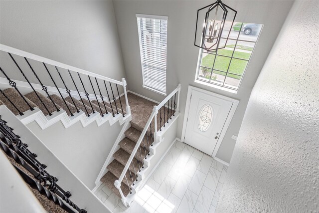 2720 Hot Springs Dr, Pearland, TX 77584 - foyer featuring a chandelier, stairs, and baseboards