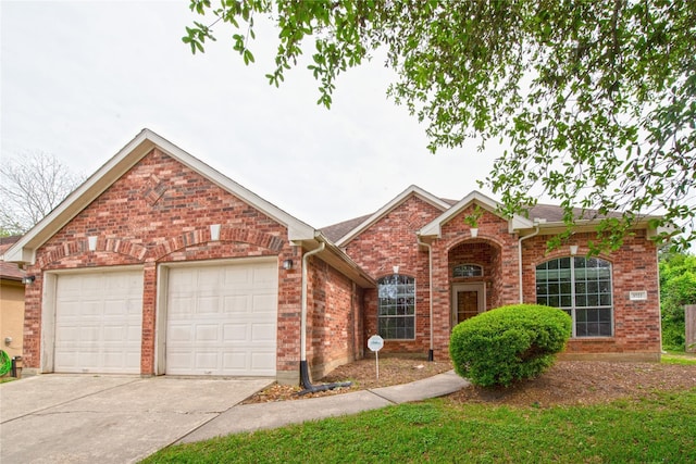 3722 Northshore Dr, Montgomery, TX 77356 - traditional-style house featuring a garage, driveway, and brick siding