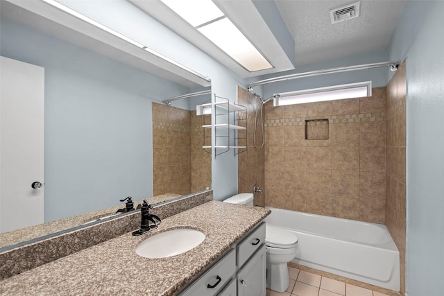 7611 Creekfield Dr, Spring, TX 77379 - full bath with toilet, tile patterned floors, washtub / shower combination, vanity, and a textured ceiling