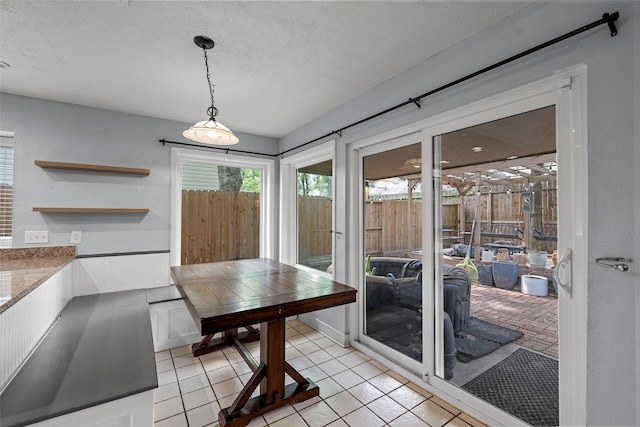 7611 Creekfield Dr, Spring, TX 77379 - dining room featuring light tile patterned floors and a textured ceiling